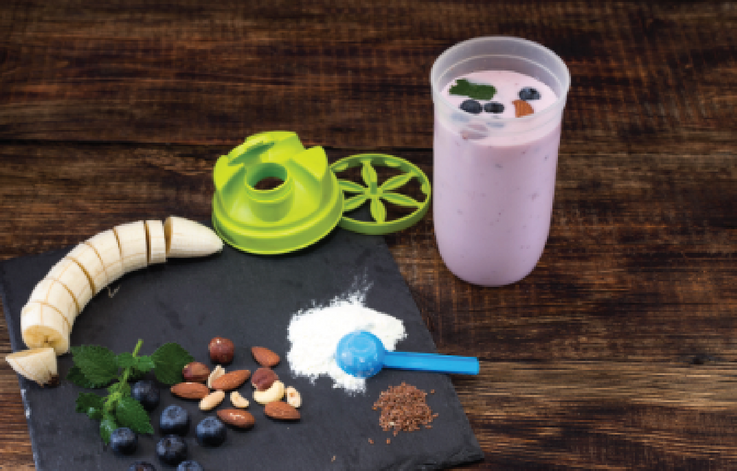 Illustrative shaker, protein powder, fruit and nuts.